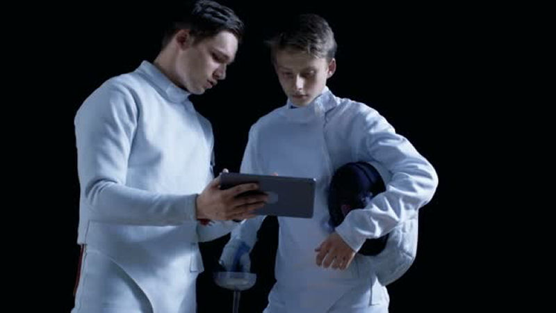 fencers on computer